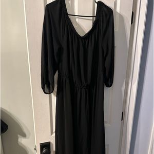 Black dress with sheer sleeves. Never worn with tags still on.